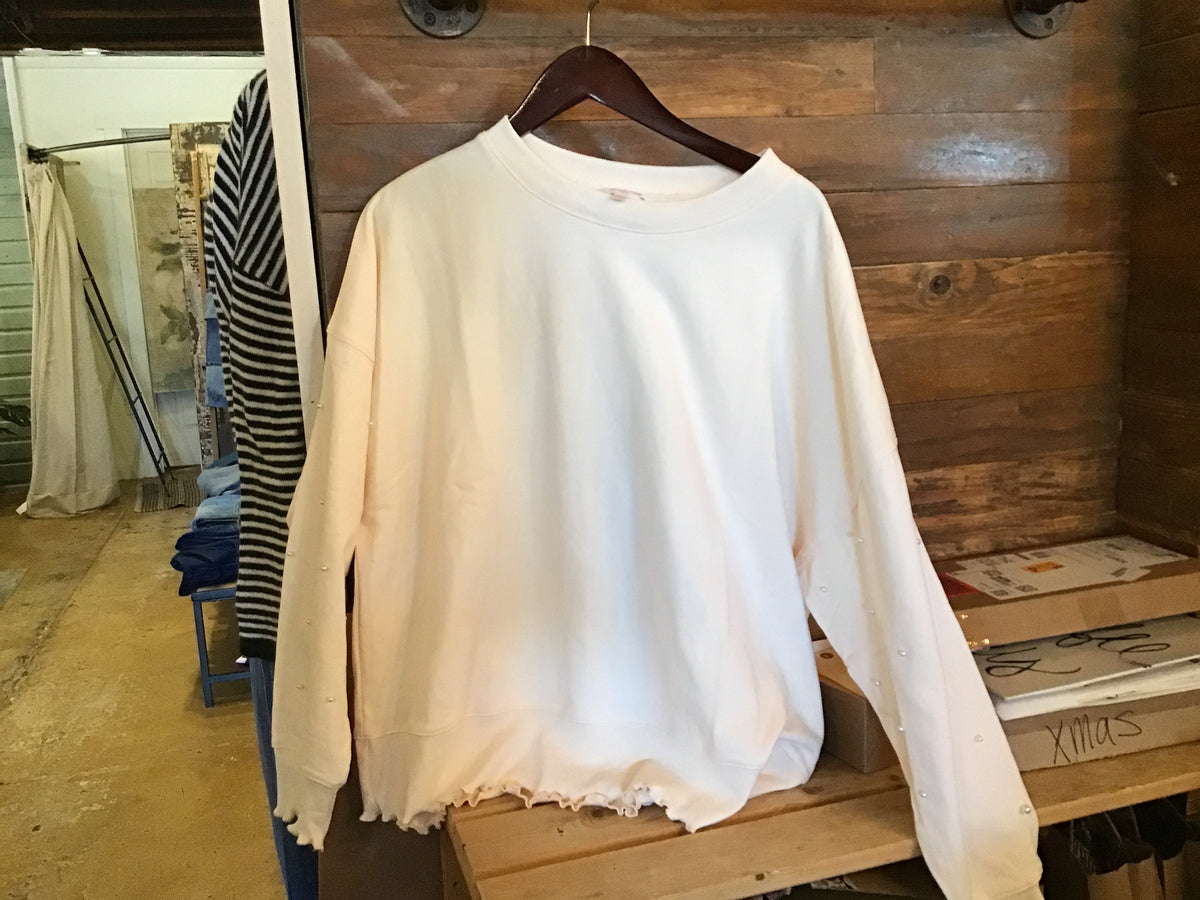 Cream Pearl Top Ruffled Hem